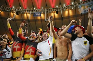 Germany fans celebrate after winning the 2014 World Cup final between Germany and Argentina at the Maracana stadium