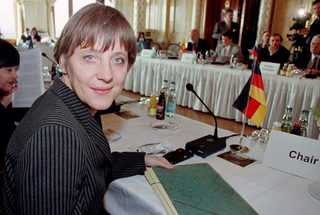 File photo of German Environment Minister Merkel smiling prior to a environmental ministers conference at Albrechtsburg castle in Dresden