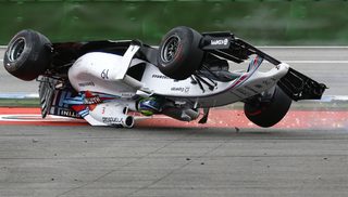 Williams Formula One driver Massa of Brazil crashes with his car in the first corner after the start of the German F1 Grand Prix at the Hockenheim racing circuit