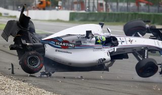 Williams Formula One driver Massa of Brazil crashes with his car in the first corner after the start of the German F1 Grand Prix at the Hockenheim racing circuit