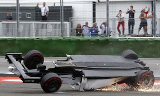 Williams Formula One driver Massa of Brazil crashes with his car in the first corner after the start of the German F1 Grand Prix at the Hockenheim racing circuit