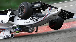 Williams Formula One driver Massa of Brazil crashes with his car in the first corner after the start of the German F1 Grand Prix at the Hockenheim racing circuit