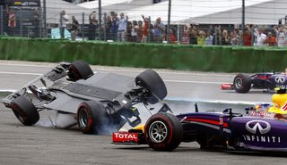 Williams Formula One driver Massa of Brazil crashes with his car in the first corner as Red Bull driver Rocciardo avoids a crash after the start of the German F1 Grand Prix at the Hockenheim racing circuit