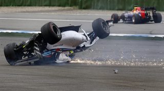 Williams Formula One driver Massa of Brazil crashes with his car in the first corner after the start of the German F1 Grand Prix at the Hockenheim racing circuit