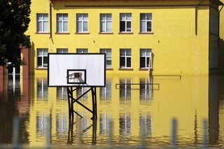A flooded school yard is seen in the town of Mizia