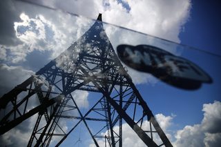 A sticker with wi-fi sign is seen on a glass fence around Gliwice radio tower