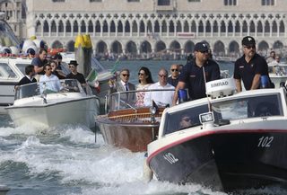 2014-09-28T151350Z_1789782095_GM1EA9S1SEH01_RTRMADP_3_PEOPLE-CLOONEY-VENICE.JPG