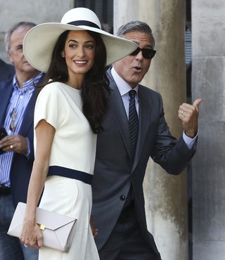 U.S. actor George Clooney and his wife Amal Alamuddin arrive at Venice city hall for a civil ceremony to formalize their wedding in Venice
