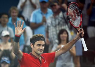Federer of Switzerland celebrates his men's singles semi final win over Dimitrov of Bulgaria at the Brisbane International tennis tournament in Brisbane