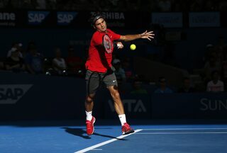 Federer of Switzerland plays a forehand return during his men's singles semi final win over Dimitrov of Bulgaria at the Brisbane International tennis tournament in Brisbane