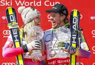 Vonn of the US and Jansrud of Norway pose with their Globes after winning the World Cup downhill trophy in the downhill races at the Alpine Skiing World Cup Finals in Meribel