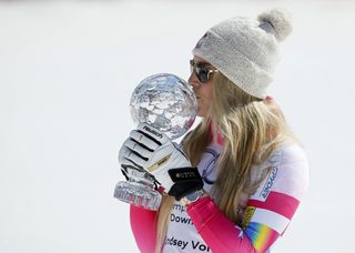 Vonn of the U.S. kisses the Globe after winning the World Cup downhill trophy in the women's downhill race at the Alpine Skiing World Cup Finals in Meribel