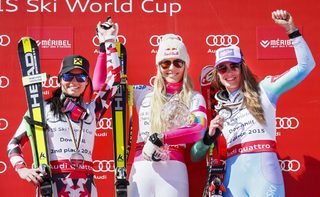 Second placed Feininger of Austria, winner Vonn of the US and third placed Maze of Slovenia pose on the podium of the women's World Cup downhill trophy in the downhill races at the Alpine Skiing World Cup Finals in Meribel