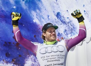 Kjetil Jansrud of Norway celebrates on the podium after winning the World Cup downhill trophy in the downhill races at the Alpine Skiing World Cup Finals in Meribel, in the French Alps