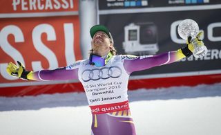 Kjetil Jansrud of Norway celebrates with his Globe after winning the World Cup downhill trophy in the men's downhill race at the Alpine Skiing World Cup Finals in Meribel
