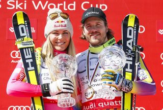 Vonn of the US and Jansrud of Norway pose with their Globes after winning the World Cup downhill trophy in the downhill races at the Alpine Skiing World Cup Finals in Meribel