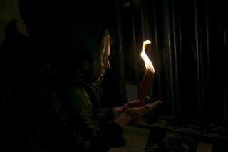 Worshippers light candles during a Holy Fire ceremony at the Church of the Holy Sepulchre in Jerusalem's Old City