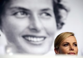 Cast member Charlize Theron attends a news conference for the film "Mad Max: Fury Road" out of competition at the 68th Cannes Film Festival in Cannes