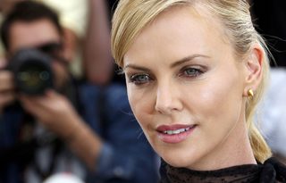 Cast member Charlize Theron poses during a photocall for the film "Mad Max: Fury Road" out of competition at the 68th Cannes Film Festival in Cannes