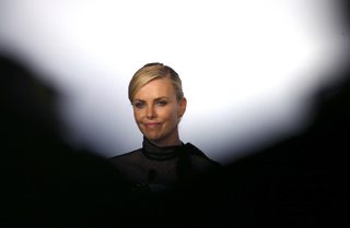 Cast member Charlize Theron attends a news conference for the film "Mad Max: Fury Road" out of competition at the 68th Cannes Film Festival in Cannes