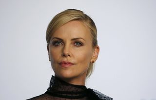 Cast member Charlize Theron attends a news conference for the film "Mad Max: Fury Road" out of competition at the 68th Cannes Film Festival in Cannes