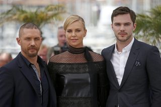 Cast members Tom Hardy, Charlize Theron and Nicholas Hoult pose during a photocall for the film "Mad Max: Fury Road" out of competition at the 68th Cannes Film Festival in Cannes