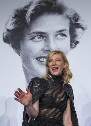 Cast member Cate Blanchett reacts as she leaves after a news conference for the film "Carol" in competition at the 68th Cannes Film Festival in Cannes