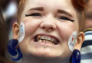A same-sex marriage supporter reacts at Dublin Castle in Dublin