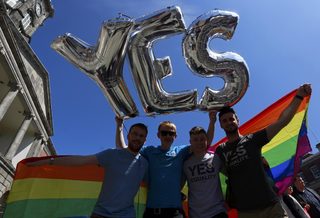 Same-sex marriage supporters pose for a photograph at Dublin Castle in Dublin