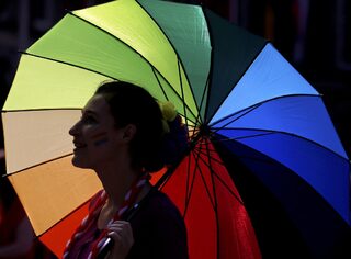 A same-sex marriage supporter poses for a photograph at Dublin Castle in Dublin