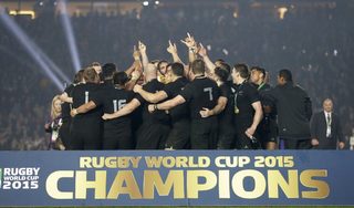 New Zealand players celebrate as they hold the Webb Ellis Cup after winning the Rugby World Cup Final against Australia at Twickenham in London