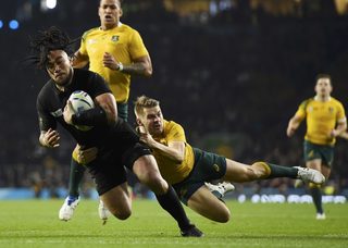Ma'a Nonu of New Zealand is tackled by Drew Mitchell of Australia as he scores a try during their Rugby World Cup final match at Twickenham in London
