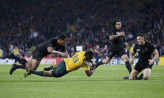 Tevita Kuridrani of Australia scores a try during their Rugby World Cup final match against New Zealand at Twickenham in London