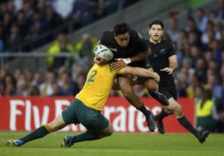 Julian Savea of New Zealand is tackled by Stephen Moore of Australia during their Rugby World Cup final match at Twickenham in London