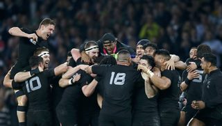 New Zealand players celebrate after beating Australia to win the Rugby World Cup final match at Twickenham in London