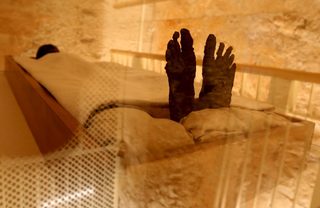 The linen-wrapped mummy of King Tutankhamun is seen in the Valley of the Kings, in Luxor