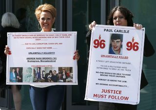 Relatives react after the jury delivered its verdict at the new inquests into the Hillsborough disaster, in Warrington, Britain