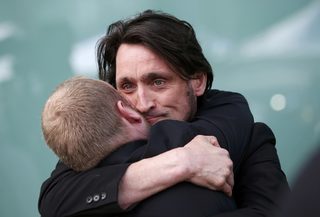 Relatives embrace after the jury delivered its verdict at the new inquests into the Hillsborough disaster, in Warrington, Britain