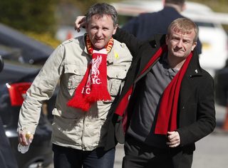 Liverpool fans arrive to hear the jury deliver its verdict at the new inquests into the Hillsborough disaster, in Warrington