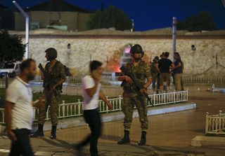 Turkish military stand guard in the Taksim Square in Istanbul
