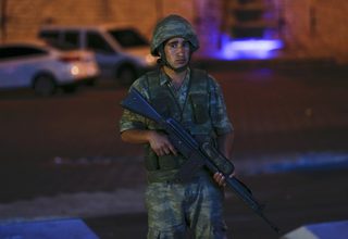 A Turkish military stands guard near the Taksim Square in Istanbul