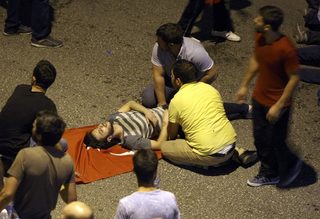 An injured man is attended during an attempted coup in Ankara