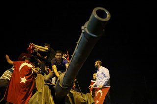 People surround a Turkish army tank in Ankara