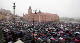 Thousands of people gather during an abortion rights campaigners' demonstration to protest against plans for a total ban on abortion in front of the Royal Castle in Warsaw