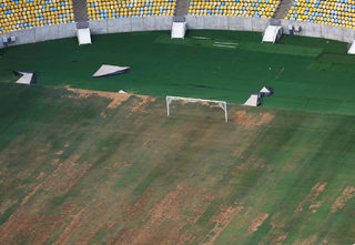 Aerial view of Maracana Stadium shows the turf dry, worn and filled with ruts and holes in Rio de Janeiro