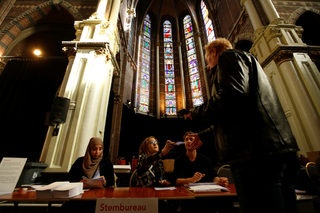 People vote during the general election at a poling station in Amsterdam