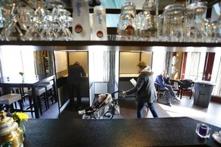 People vote in a bar used as a polling station in Driebruggen in the Netherlands