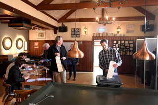 People vote in a bar used as a polling station in Ankeveen, Netherlands