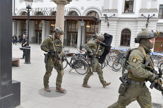 Police officers are seen outside Stockholm Central station after people were killed when a truck crashed into department store Ahlens, in central Stockholm