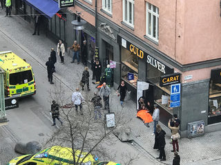 Ambulance in a street near the site were a truck was driving into a crowd in central Stockholm
